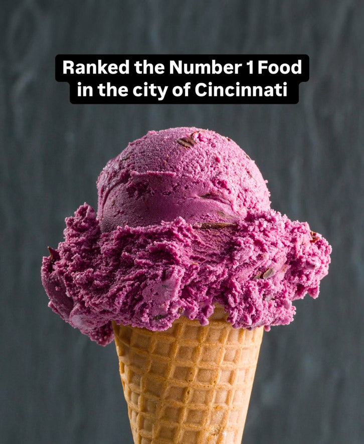 a single scoop of black raspberry chocolate chip ice cream on a sugar cone with the text "ranked the Number 1 Food in the city of Cincinnati" above it