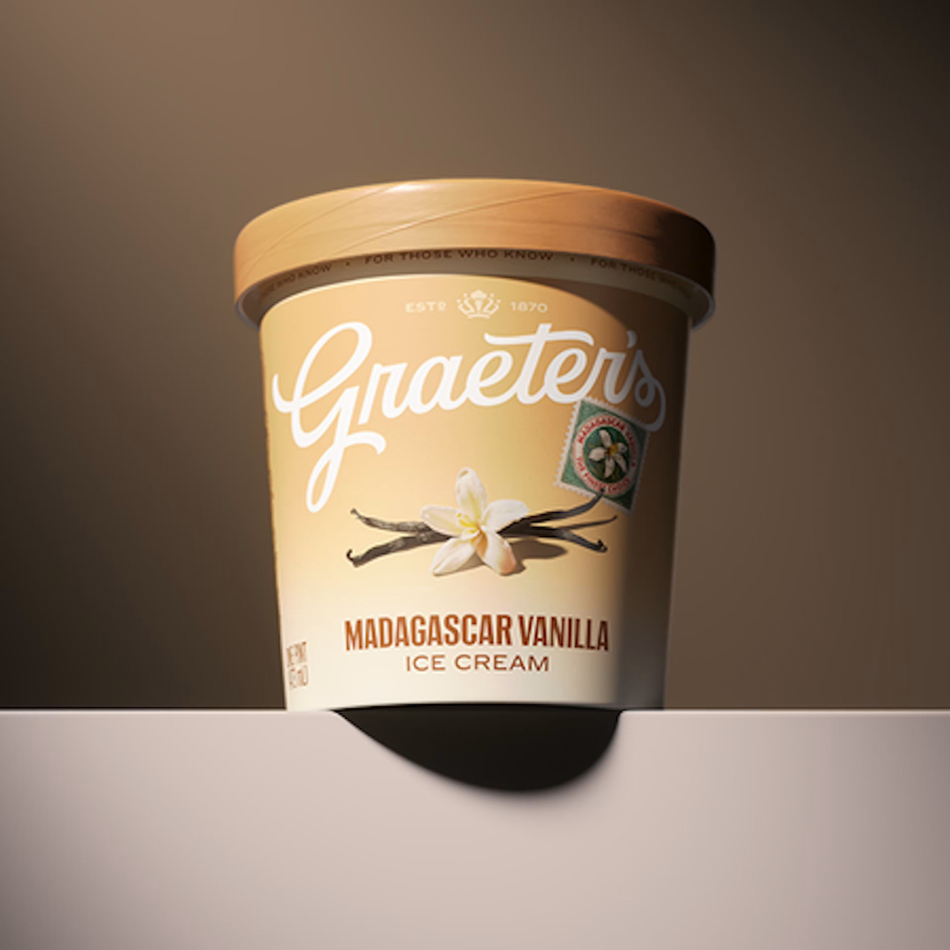 Graeter's Madagascar Vanilla ice cream container on a gradient background