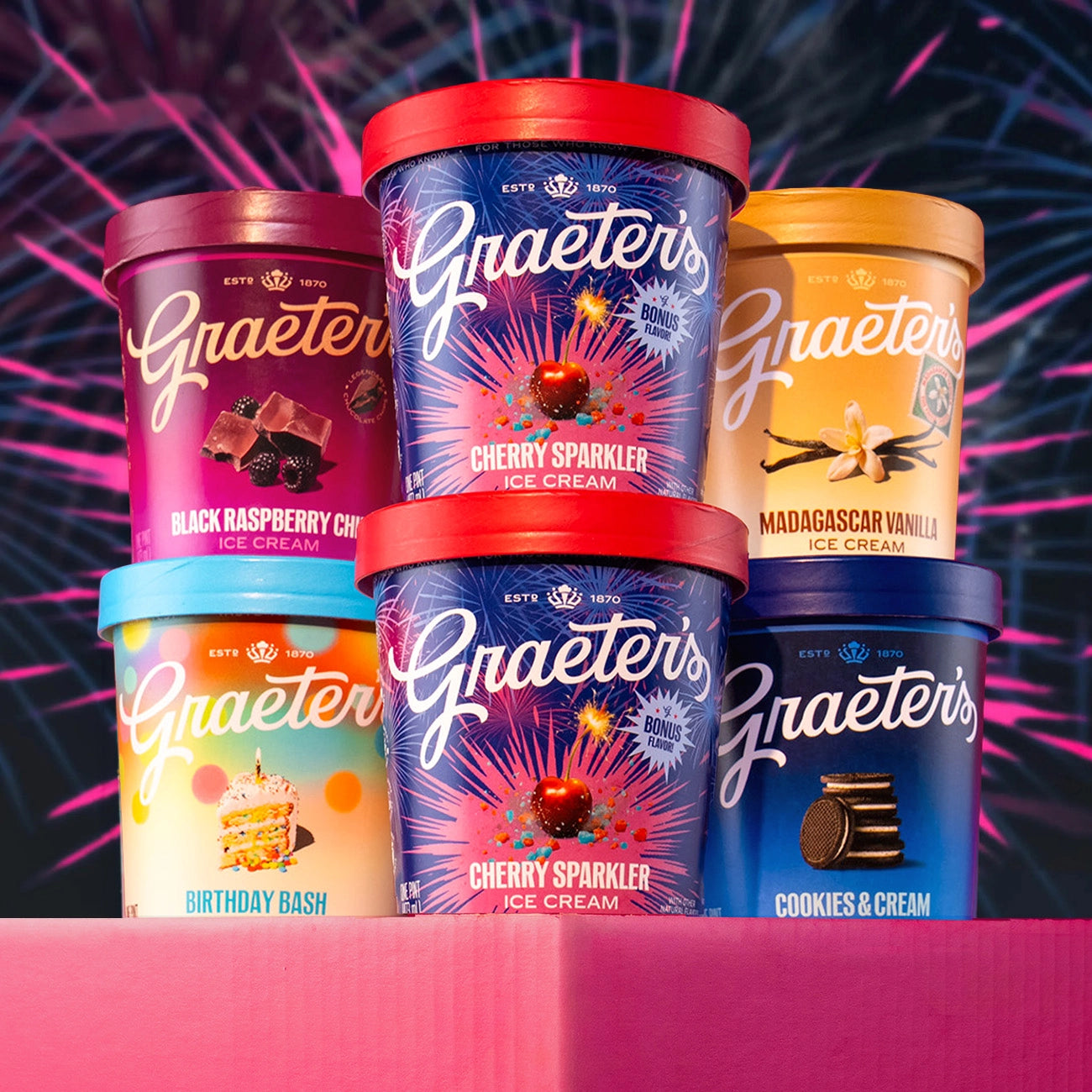 Graeter's ice cream containers with colorful lids on a red background