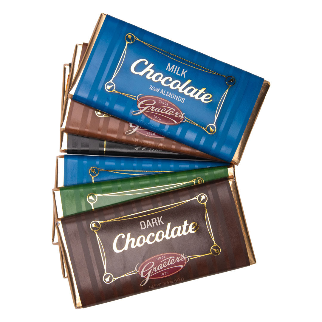 Assorted chocolate bars with visible name of Graeter's on blue and brown packaging