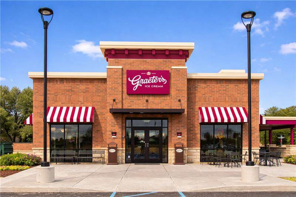 Graeter's Ice Cream store with a clear blue sky and trees in the background