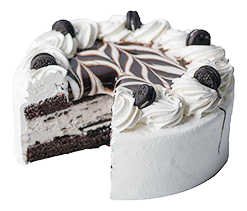 cookies n cream cake: a bright white ice cream cake, cut to show the layers of chocolate cake and cookies n cream ice cream