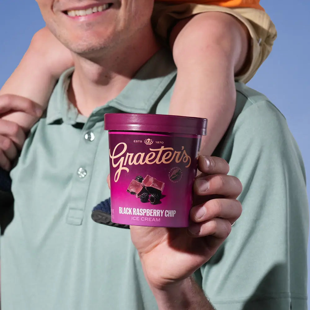 Father holding Black Raspberry Chip Ice Cream