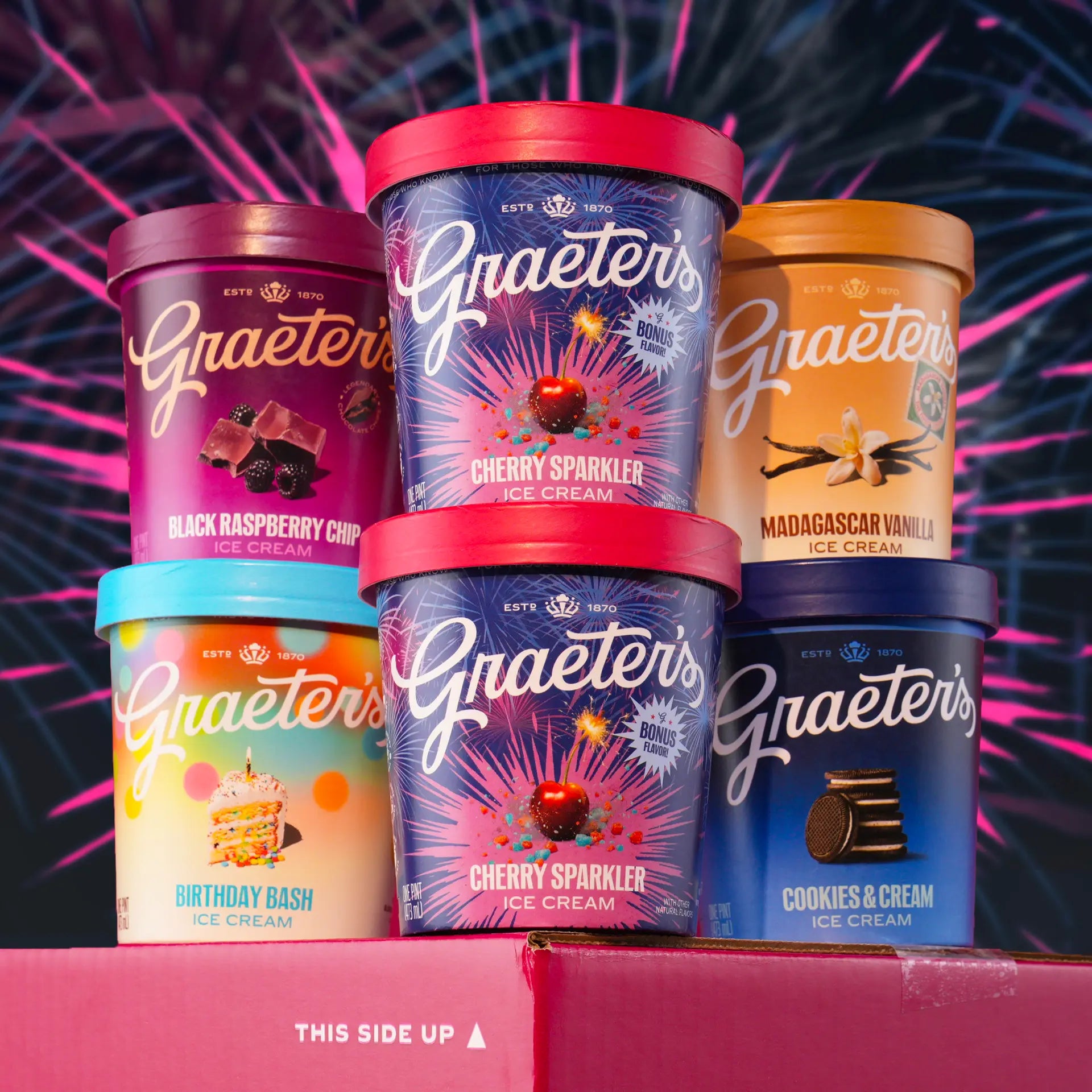 Graeter's ice cream containers with colorful lids on a red background