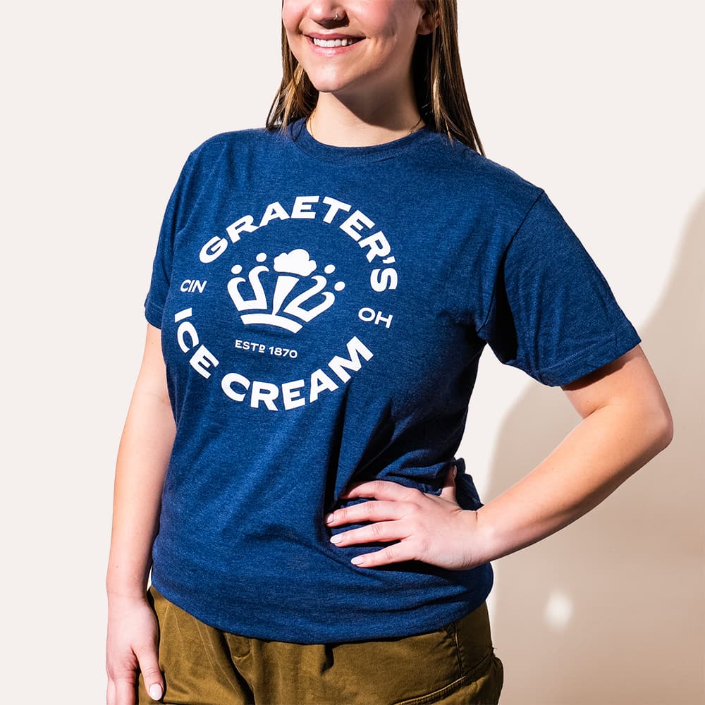 Person wearing a blue Graeter's Ice Cream t-shirt against a plain background