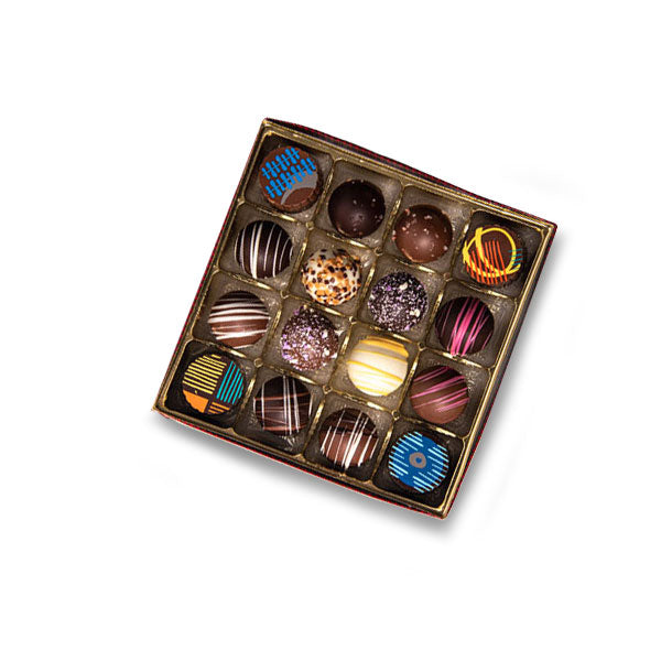 Box of assorted chocolates with colorful designs on a white background