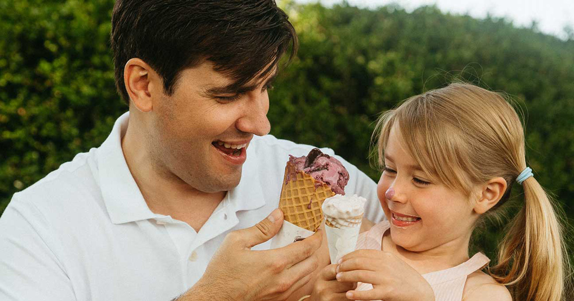 Father Eating Ice Cream With Daughter